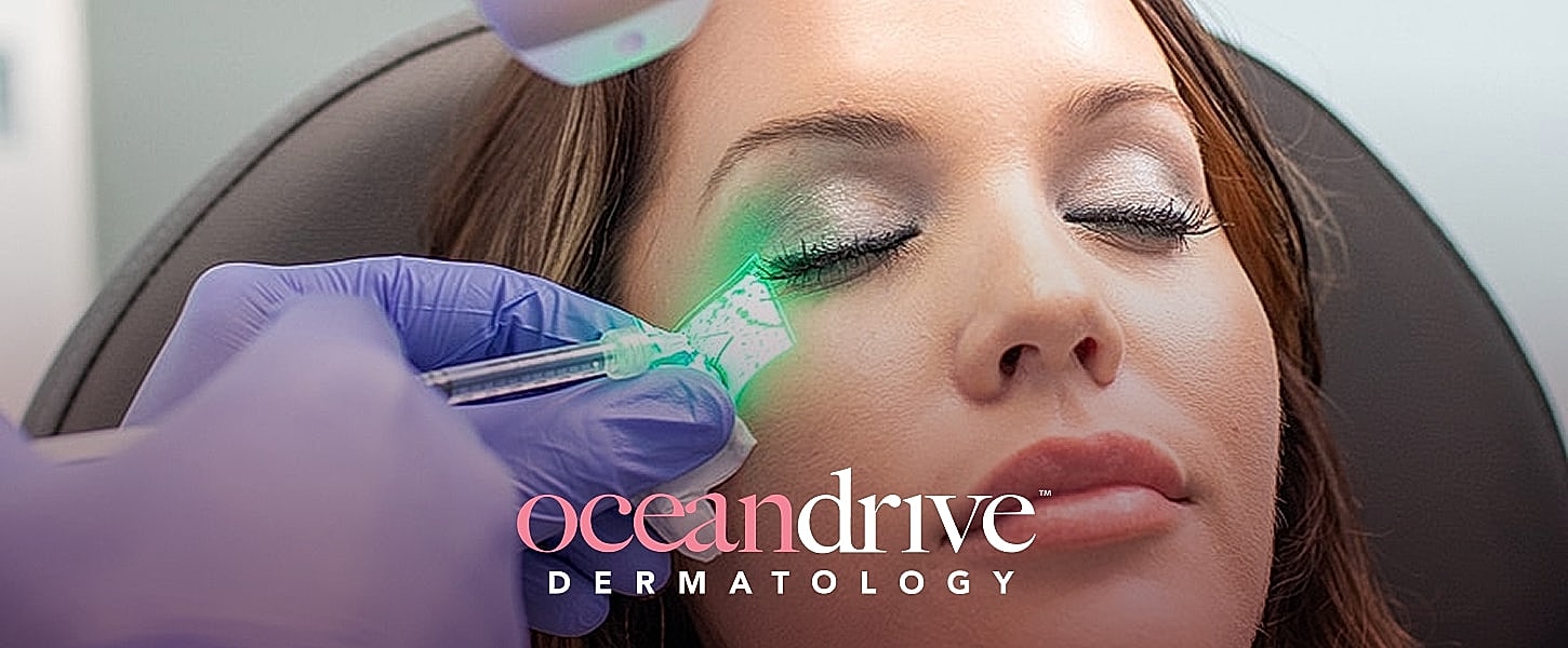 Woman receiving laser treatment at dermatology clinic.