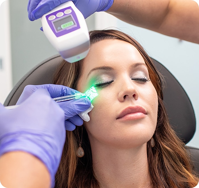 Modern reception area with green wall decor.