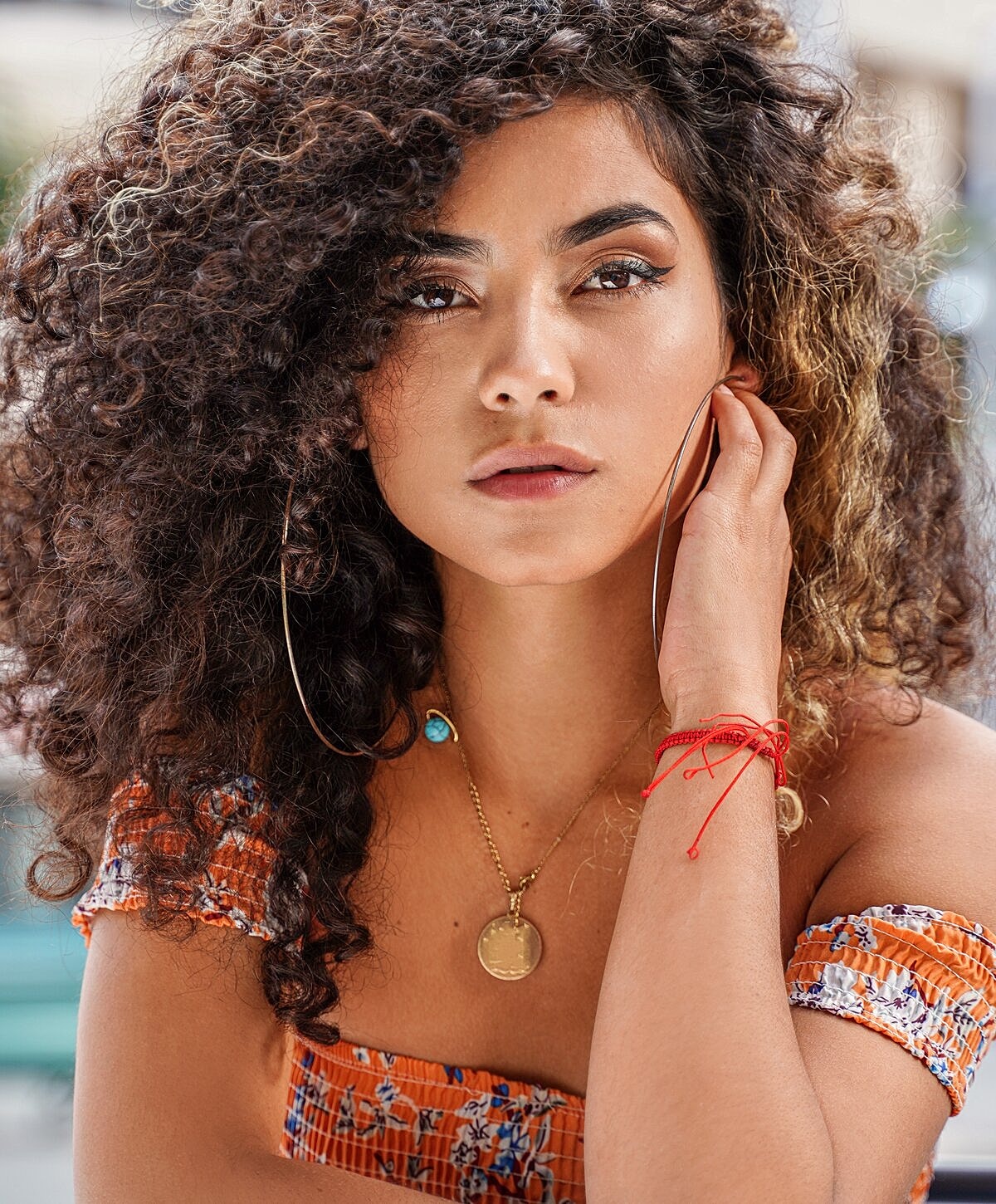 Smiling woman with long, light brown hair.