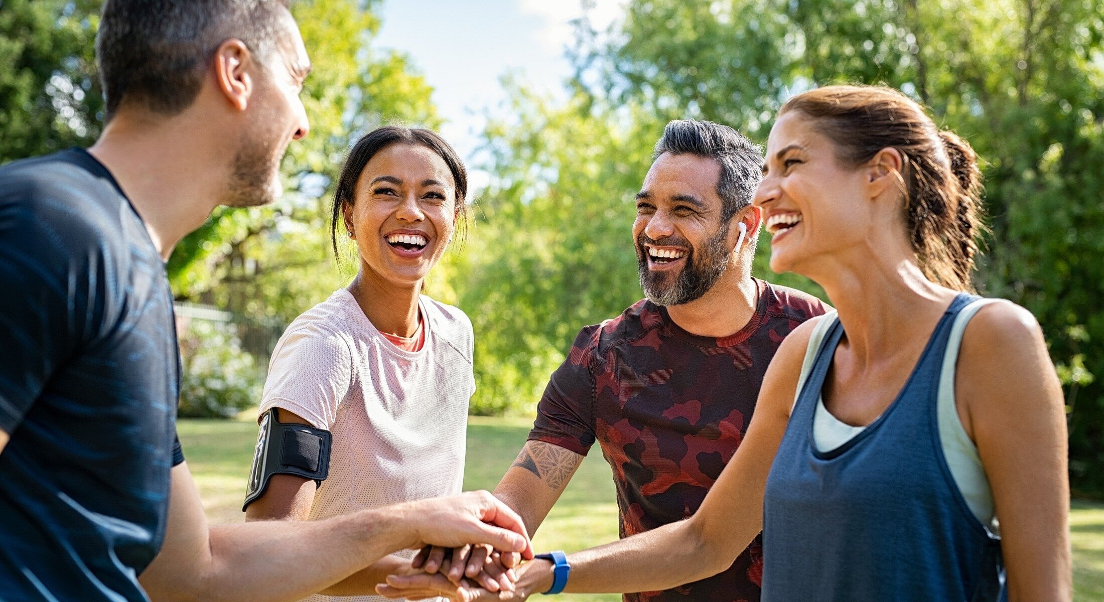 Friends enjoying laughter and connection outdoors.