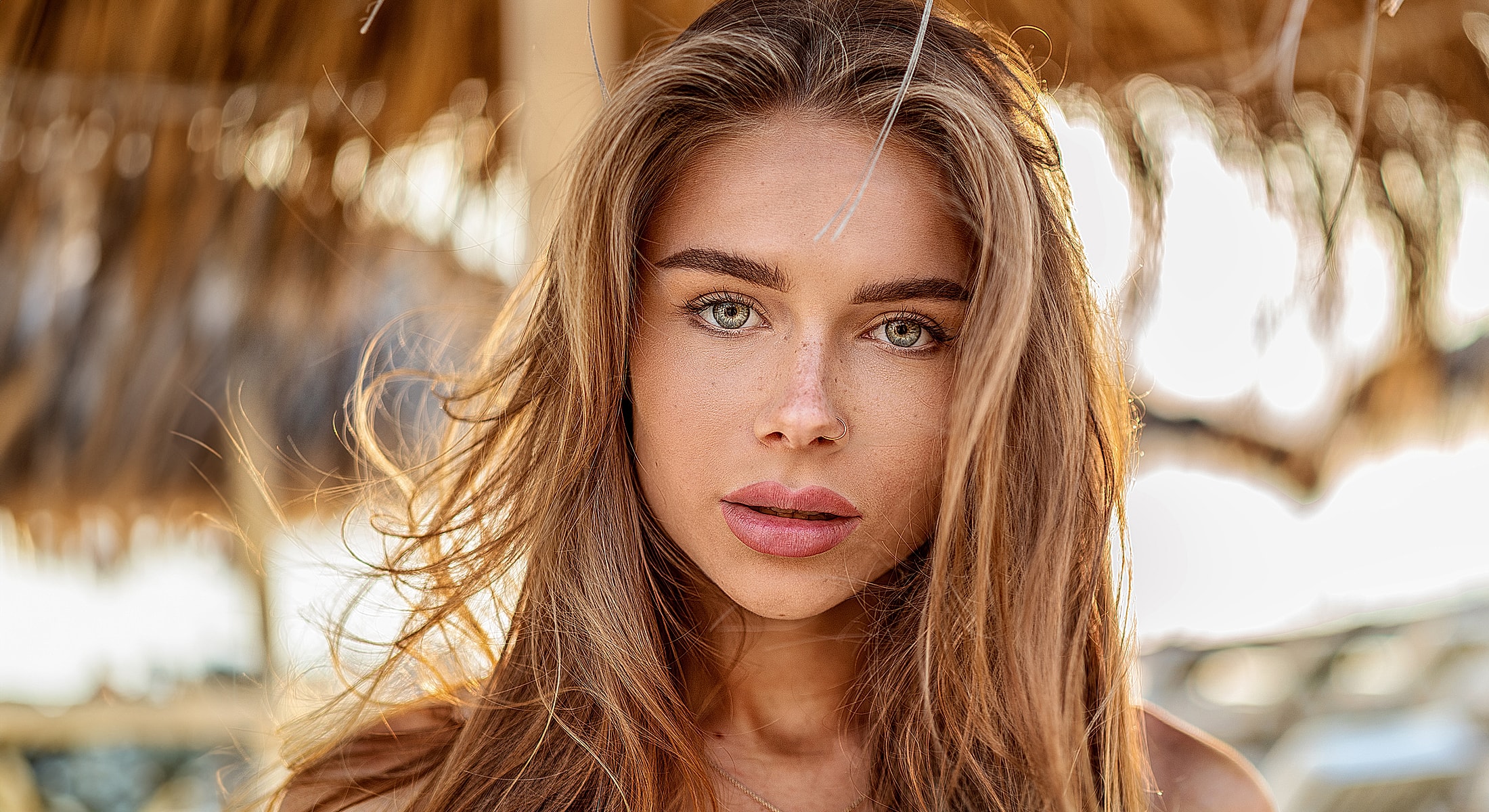 Portrait of a woman with long, flowing hair.